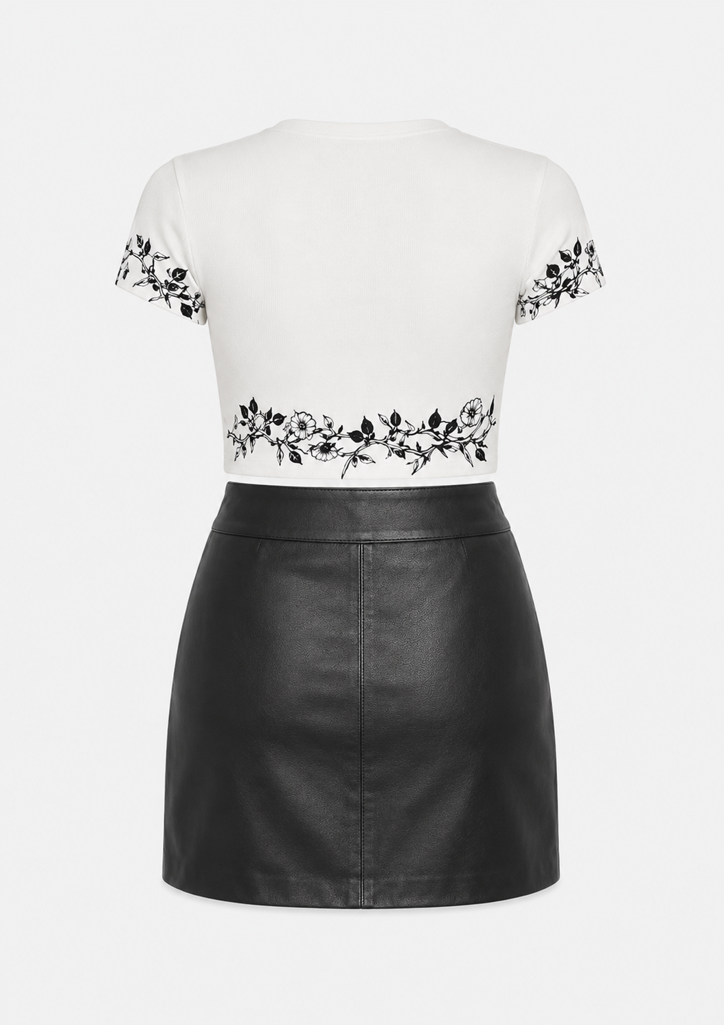 Model wearing ModYourself Urban Blossom Set featuring a fitted spandex blend top and premium faux leather skirt.