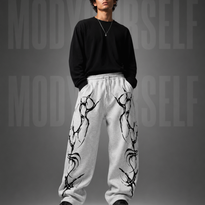 Model wearing ModYourself Straight Fit Eclipse Tribal Tracks featuring futuristic tribal graphics and luxury straight-fit silhouette.